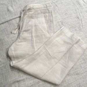 100% linen pleated wide leg pants, button/zip close w/tie waist. Size 30/32